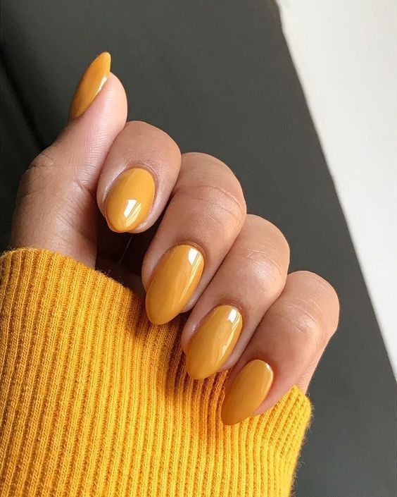 Mustard yellow almond nails, bold hue
