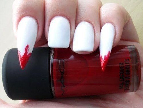 Vampire fang-themed nail accents
