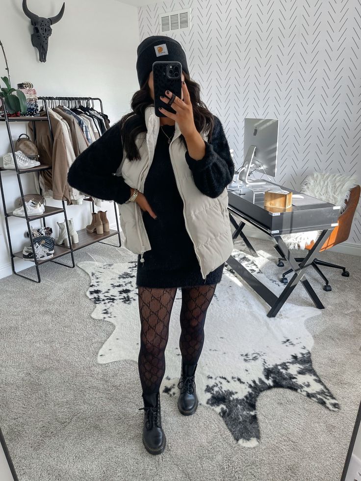 Puffer vest contrasts fitted silhouette.