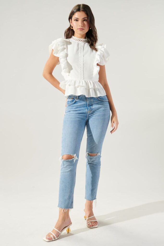 High-waisted jeans and ruffle blouse